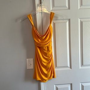 A orange dress that ties in back from Lucy in the Sky. Size small.